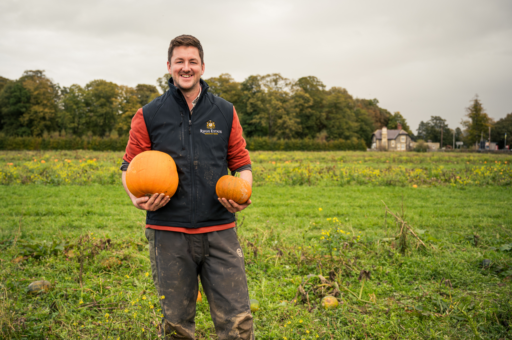 farmer standing in a field of pumpkins in North Wales