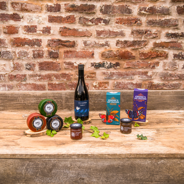 items on a table from a cheese and wine hamper featuring welsh products