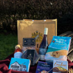 Valentines hamper - containing, authentic Italian smoked pancetta pasta sauce, authentic Italian multicolour pasta, adobe pinot noir, Newborough's Nectar chocolates, blanco mini slightly salted tortilla chips, Cartmels sticky chocolate pudding, snowdonia cheese black bomber Welsh rarebit cheese bake, regrows rustic crackers. and a large Rhug Estate hessian bag