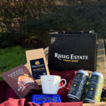 His Hamper - containing, forest feast praline crisp milk chocolate hazelnuts, Rhug estate coffee, Hapus mug, gentleman's hardware toolkit, 1 x organic stout, 1 x organic lager, in a small, back, rhug farm shop hessian bag